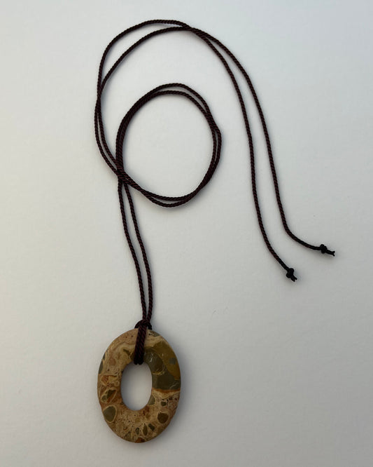 #19 the orbit pendant on brown string